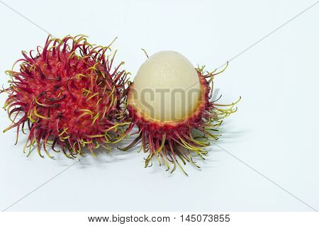 Rambutan fruit peel ripe red on a white background.