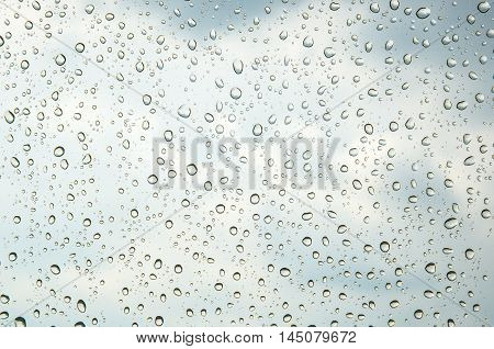 raindrops flowing through glas, closeup texture water