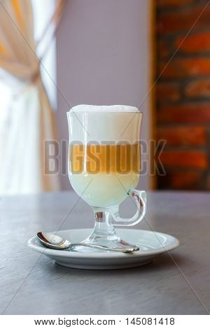 a cup of latte on the table