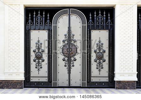 Wrought metal gates . Front of the house.