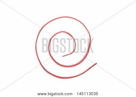 A red colored shoelace shaped into a spiral isolated on white