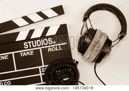 Slate film and headphone directorate, effect white backgroun
