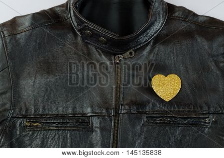 Heart of gold on old black leather jacket