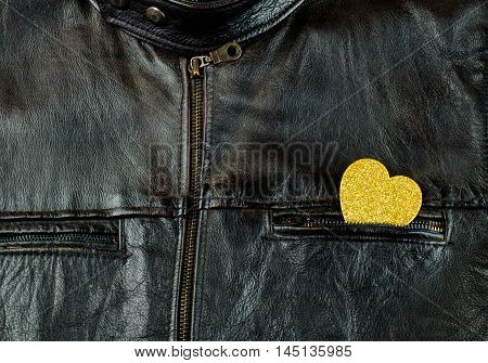 Heart of gold on old black leather jacket