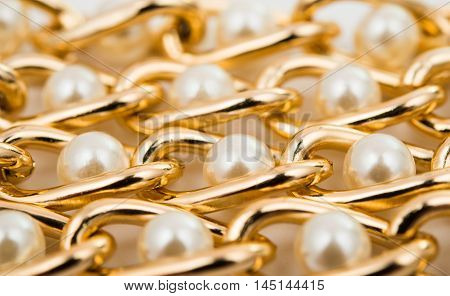 Pearl necklace over elegance bracelet white background