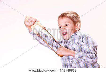 Young Boy Use Sling Shot Shoot Mandarine.