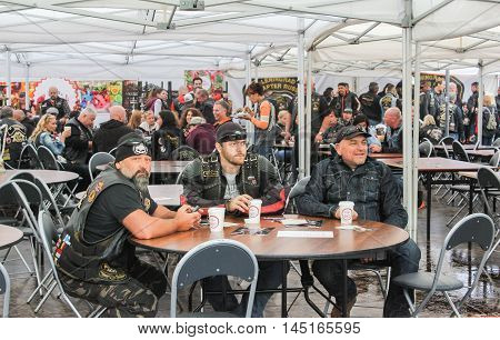 St. Petersburg, Russia - 12 August, Bikers at the table,12 August, 2016.
The annual International Festival of Motor Harley Davidson in St. Petersburg Ostrovsky Square.