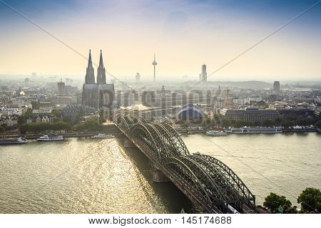 Koln Cityscape With Cathedral And Steel Bridge, Germany