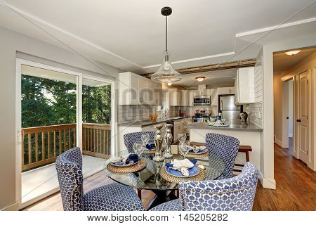 Dining Area With Blue Chairs And Table Setting