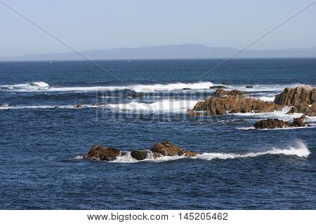 This is an image of waives and rocks as the tide comes in at
Asilomar State Preserve in Pacific Grove, California.