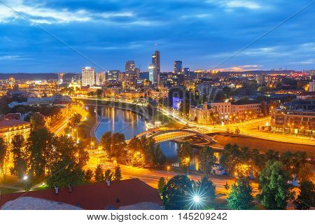 Aerial panoramic cityscape with skyscrapers of New Center of Vilnius from Gediminas Tower at night, Lithuania, Baltic states.