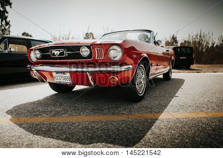 MALAGA, SPAIN - JULY 30, 2016: 1966 Ford Mustang front view in red color, parked in Malaga, Spain.