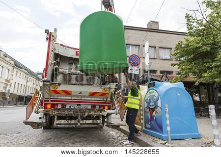Recycling Truck Picking Up Trash Bins