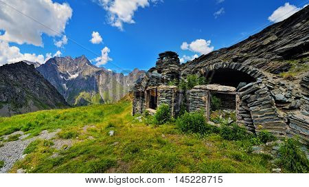 ruins of old farm at alpien mountains in Aosta Valley