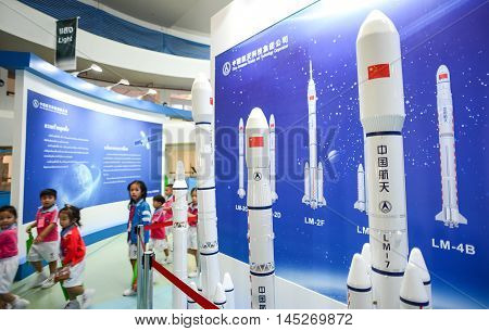 Roiet Thailand - Aug 23 2016 : Kindergarten students walk past The Space exposition by China National Space Administration(CNSA) at Roiet Science Centre Thailand