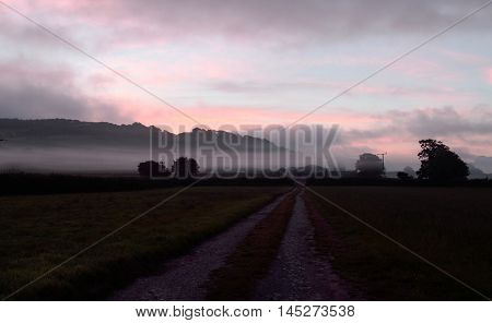 Morning mist over farmland in Axe Valley, Devon