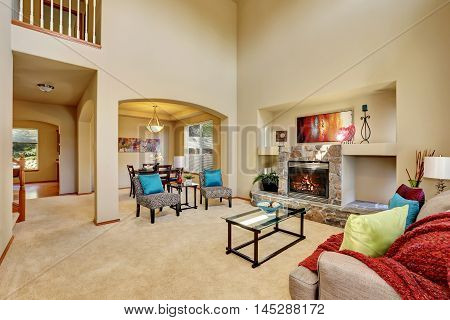 Cozy Luxury Family Room With High Ceiling And Arched Doorway