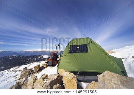Camping on the top of the mountain in winter.