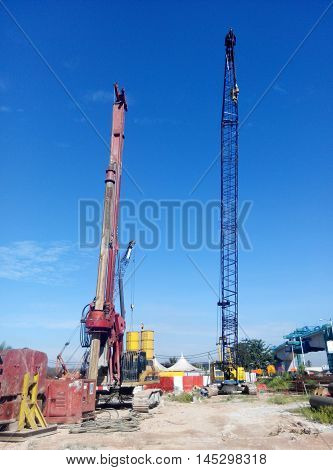 MALACCA, MALAYSIA -MARCH 12, 2015: Bore pile rig machine at the construction site in Malacca, Malaysia. The machine used to driven pile for building foundation work.