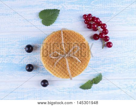 Stack Of Dutch Caramel Waffles. Strack Of Traditional Dutch Waffle Called Stroopwafel On Blue Backgr