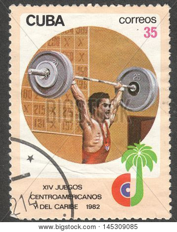 MOSCOW RUSSIA - CIRCA AUGUST 2016: a stamp printed in CUBA shows weightlifting the series "The 14th Central American and Caribbean Games Havana" circa 1982