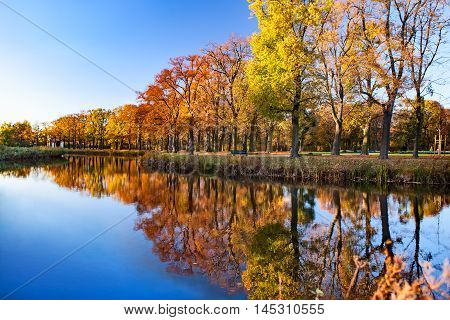 View on autumn landscape of river and trees. Herrenhausen Gardens, Hannover