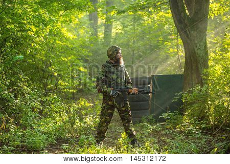 Soldier With Rifle In Forest