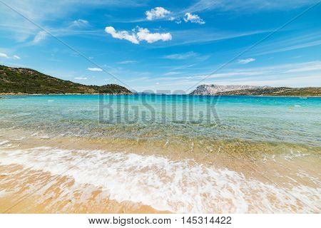 Capo Coda Cavallo shoreline on a clear day Sardinia
