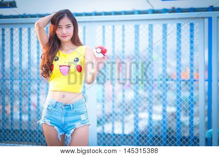 Bangkok, Thailand – August 24,2016:  Trainer  Girl   Playing Pokemon , Pokemon Ball