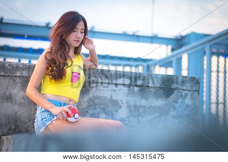 Bangkok, Thailand – August 24,2016:  Trainer  Girl   Playing Pokemon , Pokemon Ball