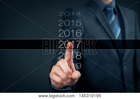 Businessman welcome year 2017. Business new year card concept.
