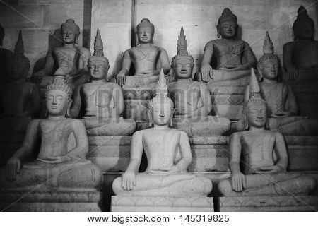 other of Buddha statue buddha image used as amulets of Buddhism religion black and white high contrast picture style selective focus