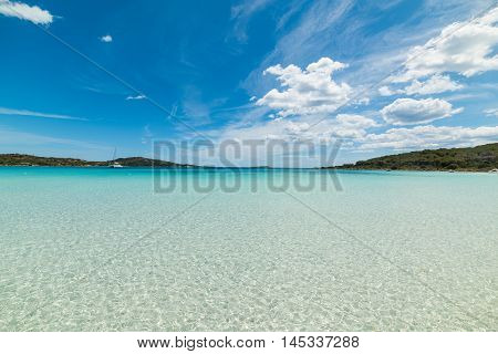 cala brandinchi under a bue sky with clouds Sardinia