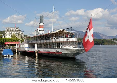 LUCERNE SWITZERLAND - MAY 04 2016: Wilhelm Tell steamship built in 1908 then restored to its original splendor nowadays is permanently anchored and invites on board to the well known restaurant
