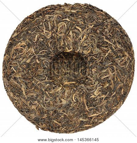 Yunnan raw puerh tea with stone impress isolated