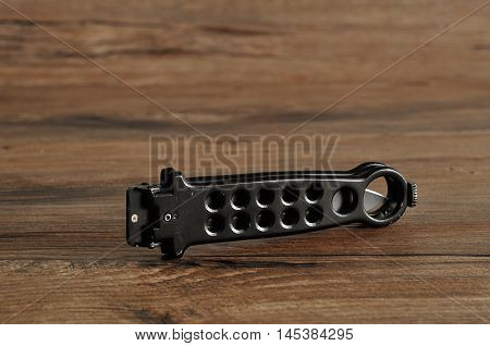 Steel butterfly knife (balisong) isolated on a wooden background