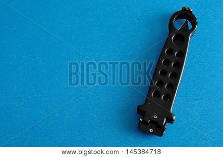 Steel butterfly knife (balisong) displayed on a colorful background