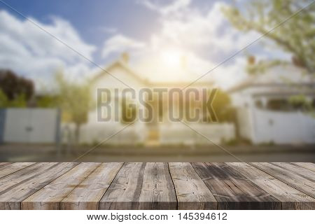 Wood Table Top (as House) On Blur House Background - Can Be Used For Display Or Montage Your Product