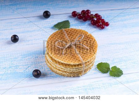 Stack Of Dutch Caramel Waffles. Strack Of Traditional Dutch Waffle Called Stroopwafel On Blue Backgr