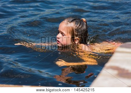 Little Girl Bathes In Lake