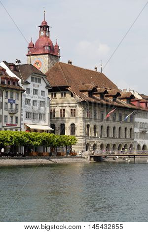 LUCERNE SWITZERLAND - MAY 02 2016: Town Hall was built in the early 1600s it is impresive building together with its tower is located down by the river Reuss.