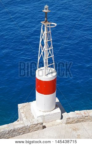 Sea Navigation Beacon Tower on a Deep Blue Background