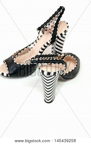 Pair Of Female High Heeled Slingbacks With Striped Heels Isolated On White.