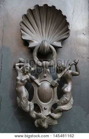 Old and ancient knocker in the city of Rome