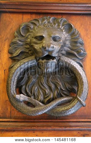 Old and ancient knocker in the city of Rome