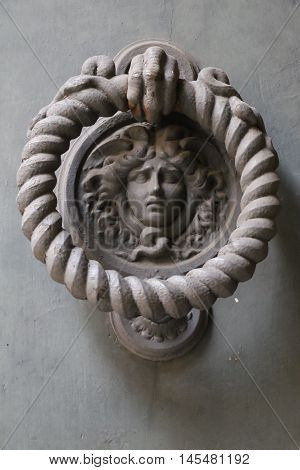 Old and ancient knocker in the city of Rome