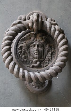 Old and ancient knocker in the city of Rome