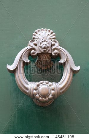 Old and ancient knocker in the city of Rome