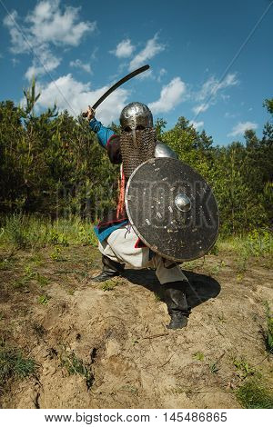 Mongol horde warrior in armour holding traditional saber