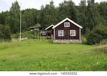 TORPO, NORWAY - JULY 2, 2016: There are houses and homestead land in the highland countryside.
